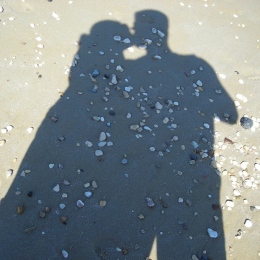 Shadow of kissing couple